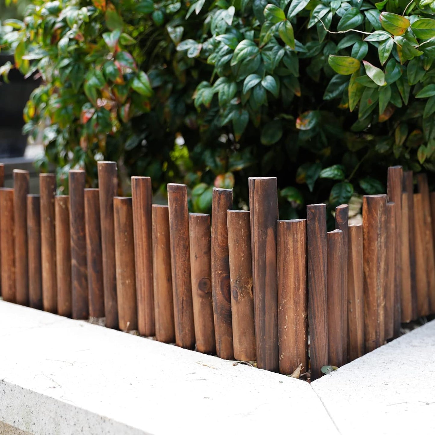 Worth Garden Wooden Staggered Short Fence - 8 in. H. x 3.7 ft. L. Burnt Wood Finish Outdoor Landscape Edging Flexible Decorative Border - Garden Yard Flower Bed Tree Fence - Stakes 4 in. Height